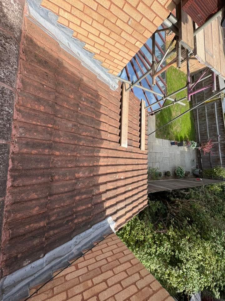 Roof cleaning at eaves and gutter line